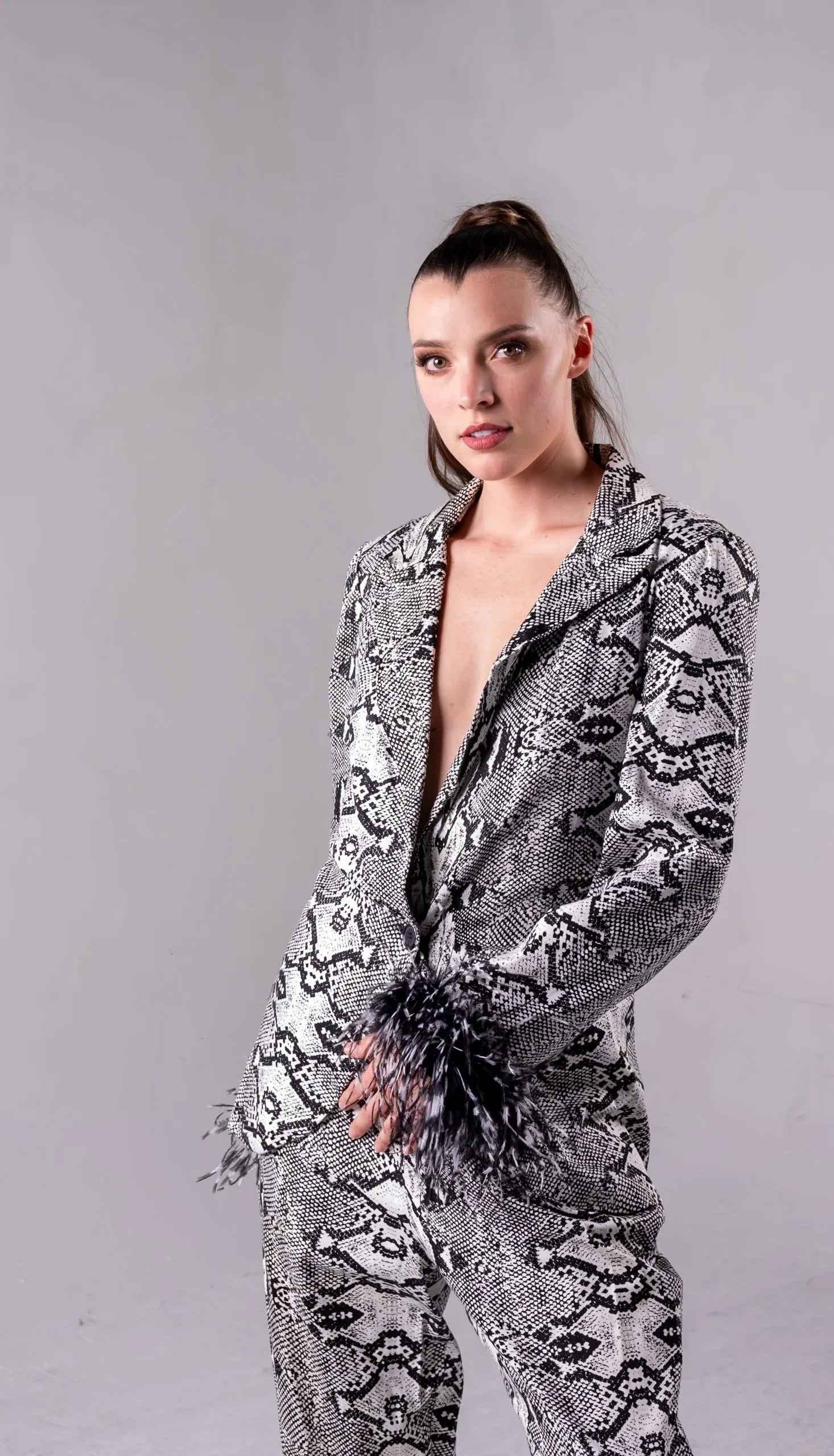 Snakeskin Print Suit With Black And White Feather Cuffs